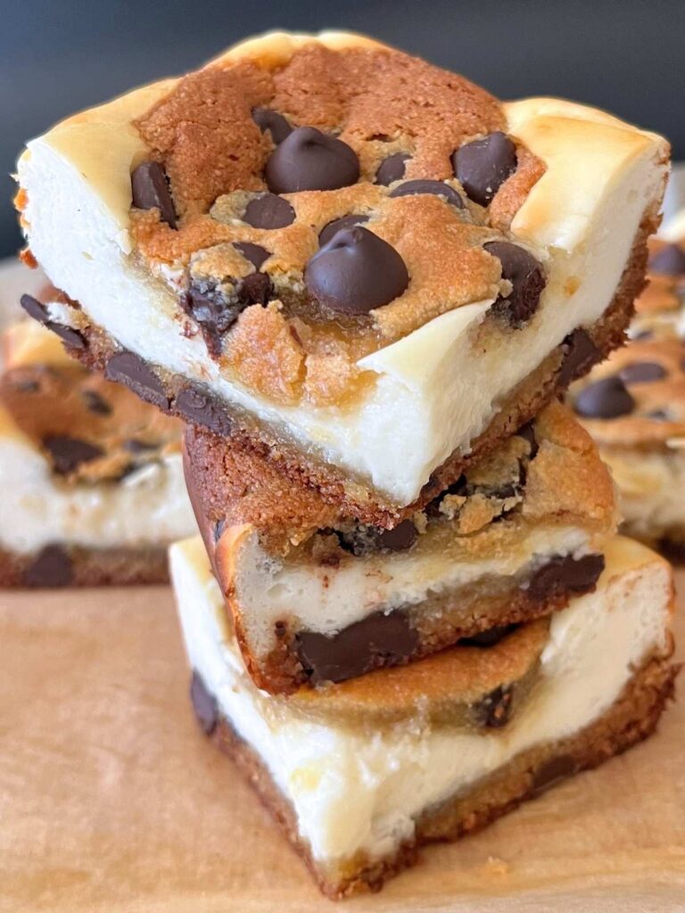 keto chocolate chip cheesecake bars stacked on top of each other