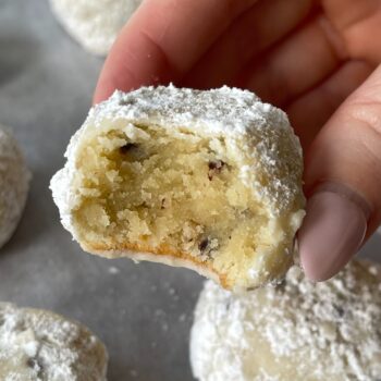 keto snowball cookie with a bite taken