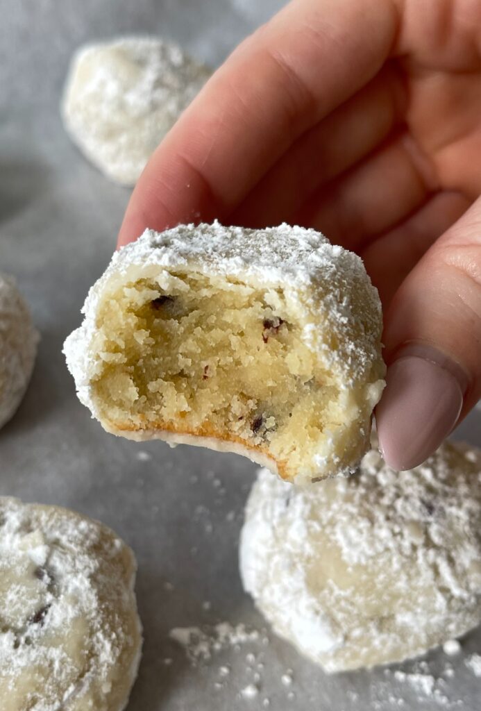 keto snowball cookie with a bite taken