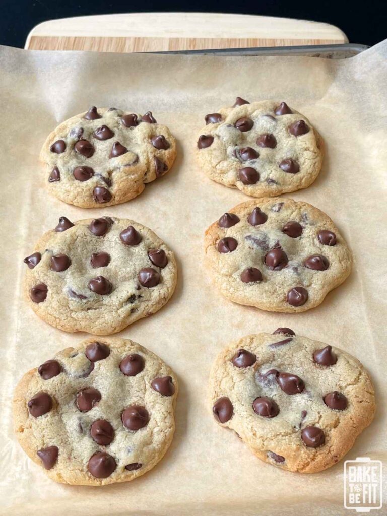gluten free chocolate chip cookies on a baking sheet with parchment paper