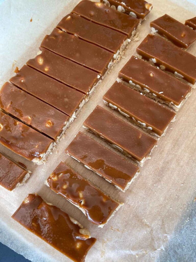 the snickers bars sliced into bars before being dipped in chocolate