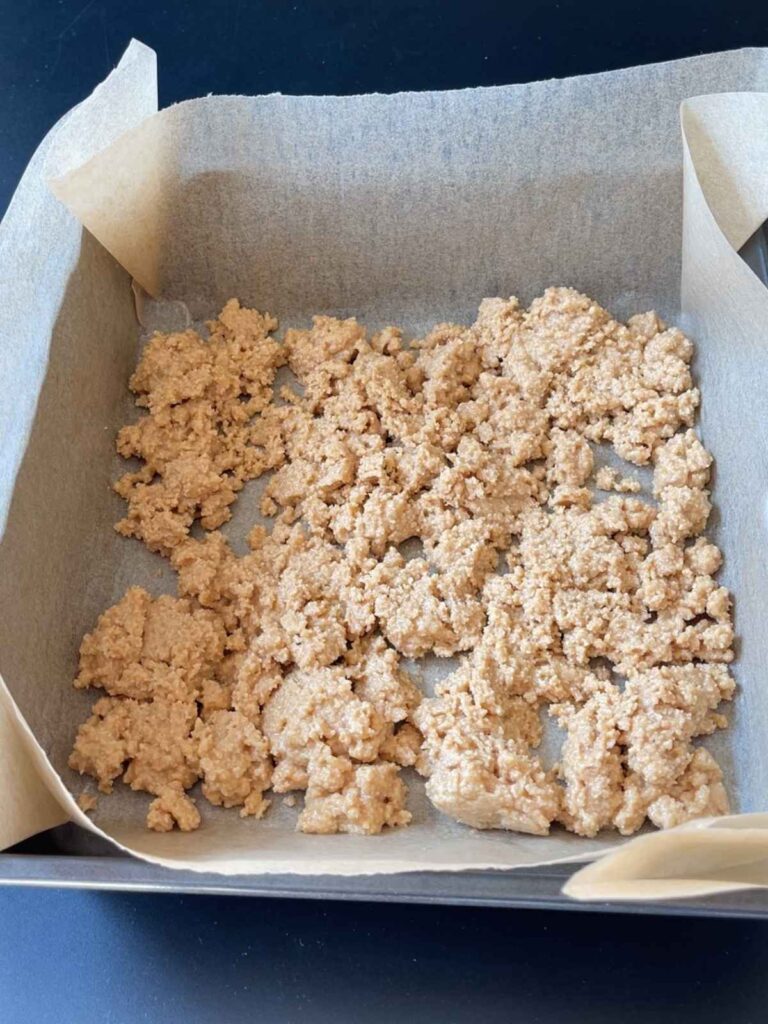 adding the nougat mixture to the pan
