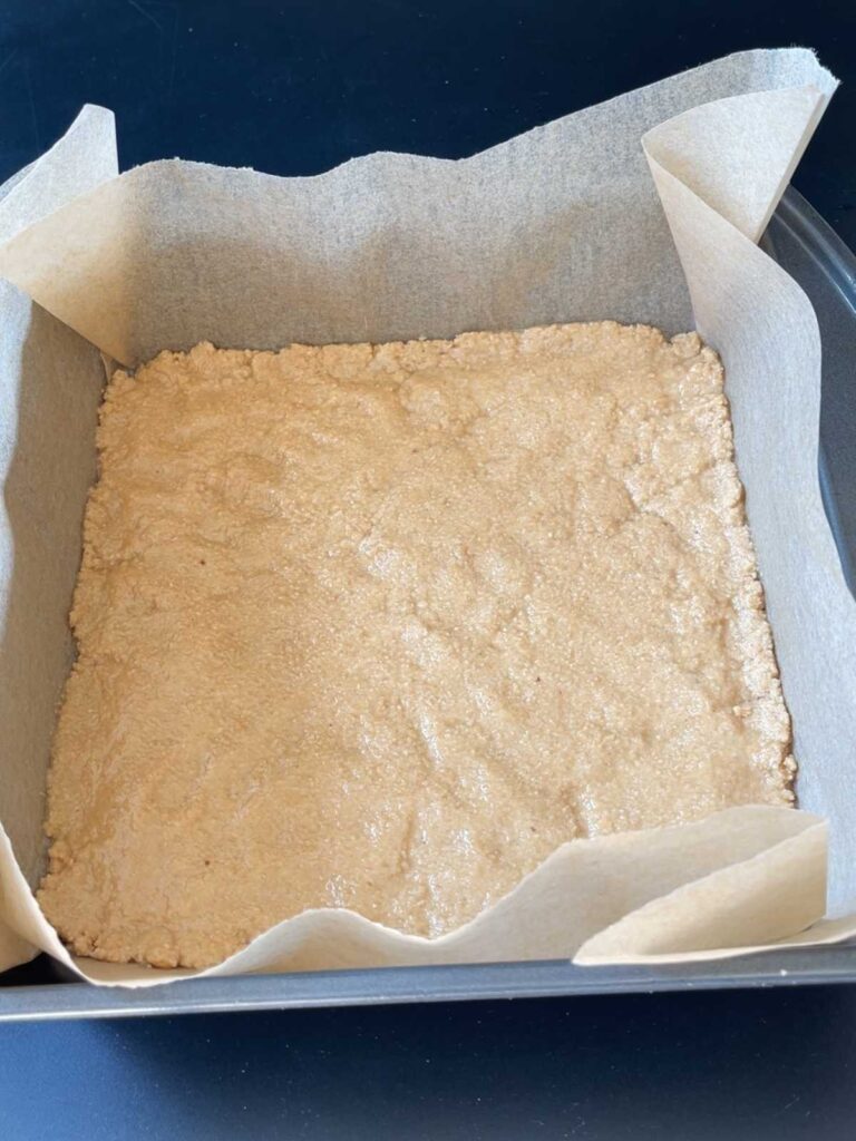 the nougat mixture shown evenly spread into the pan