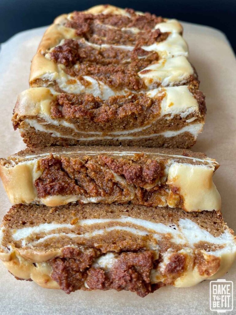 a loaf of pumpkin cream cheese bread cut into slices