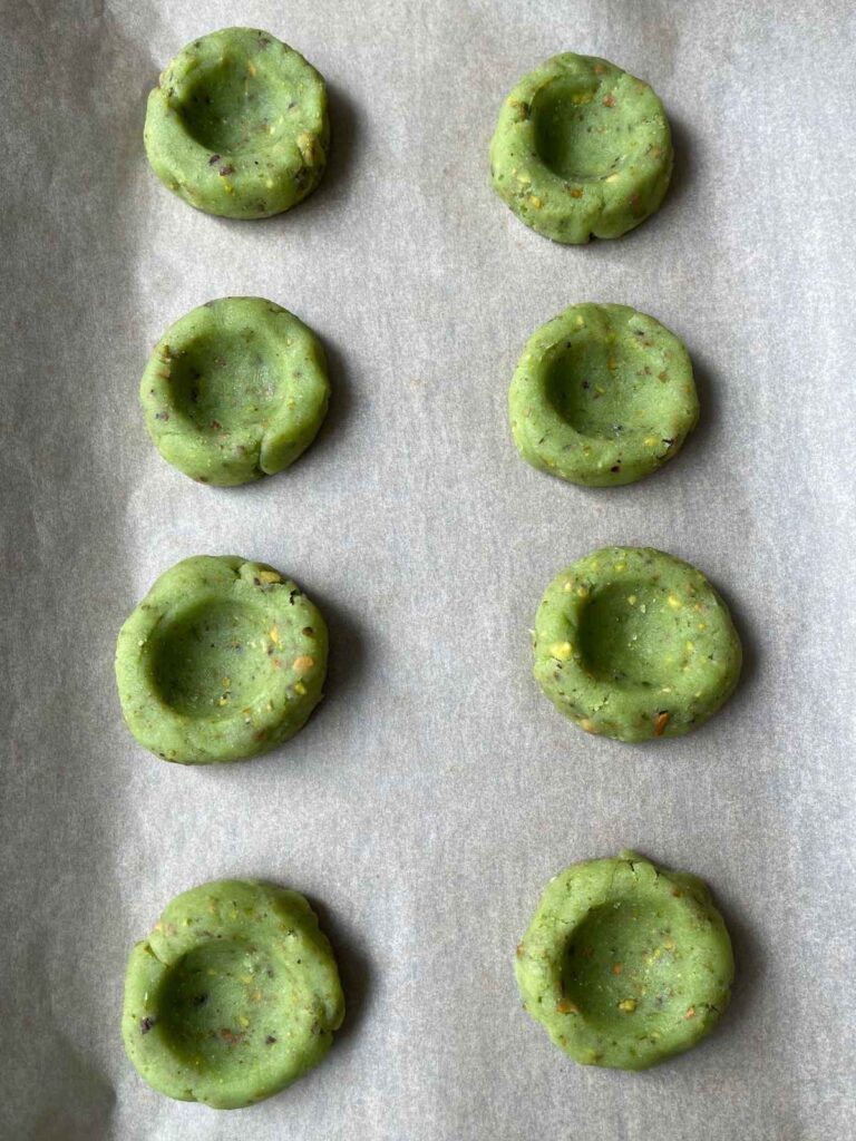 keto pistachio cookie dough with wells for the filling